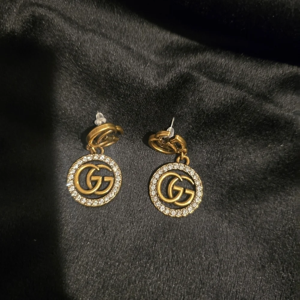 Gucci 18kgp Gucci Gold and Silver Crystal Logo Earrings